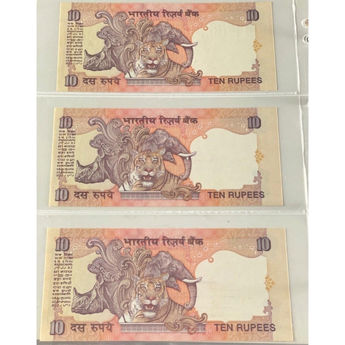 176 - A Numis banknote album containing a substantial collection of RESERVE BANK OF INDIA Ghandi notes in ... 