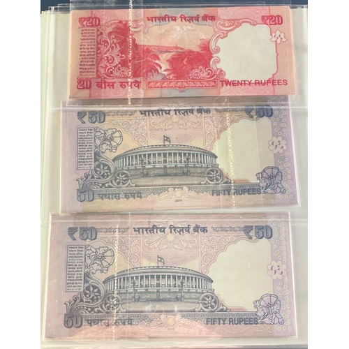 176 - A Numis banknote album containing a substantial collection of RESERVE BANK OF INDIA Ghandi notes in ... 