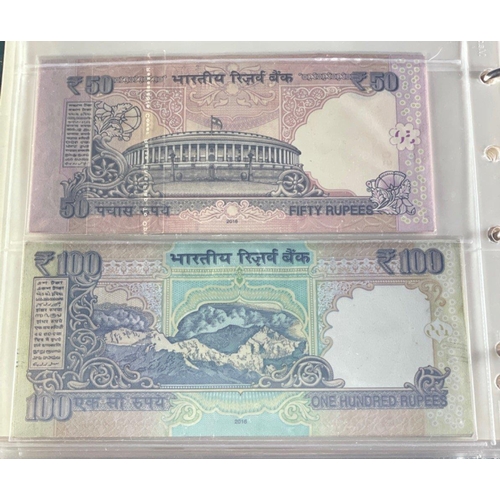 176 - A Numis banknote album containing a substantial collection of RESERVE BANK OF INDIA Ghandi notes in ... 