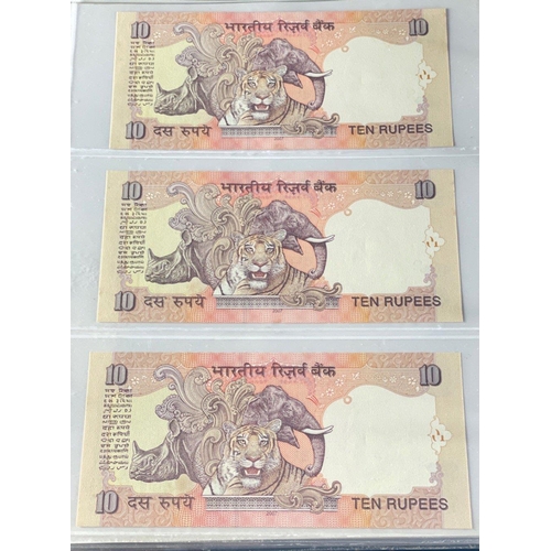 176 - A Numis banknote album containing a substantial collection of RESERVE BANK OF INDIA Ghandi notes in ... 