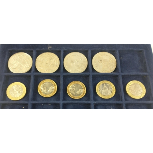 235 - A Westminster 2 tier coin display case with 16 five pound coins, and 5 £2 coins#235