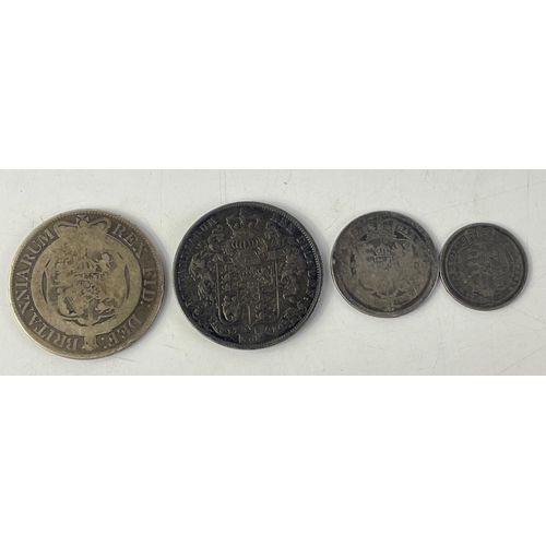 245 - A small lot of four early silver coins of interest to include a rather pleasing toned George IV 1825... 