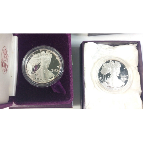 247 - Four boxed SILVER ONE OUNCE PROOF AMERICAN EAGLES in boxes with interior plush cases. 1986, 1989, 19... 