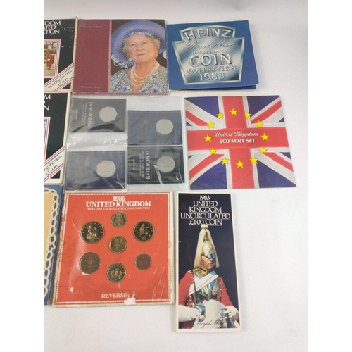 284 - A collection of coins and coin sets on cards to include 1971 Russian Revolution  1 Crown Cover, Isle... 