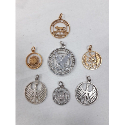 317 - Numismatists hide your eyes!  A lovely small collection of cut coin pendants.  Seven original coins ... 