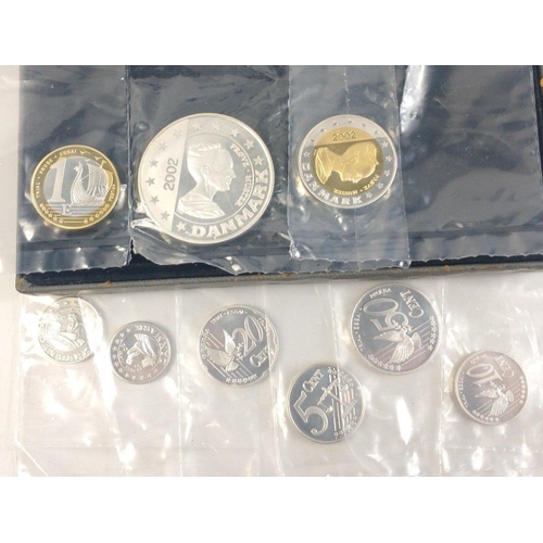 322 - 2002 DENMARK Euro 9 coin set in original packets with coa and a damaged display case.#323