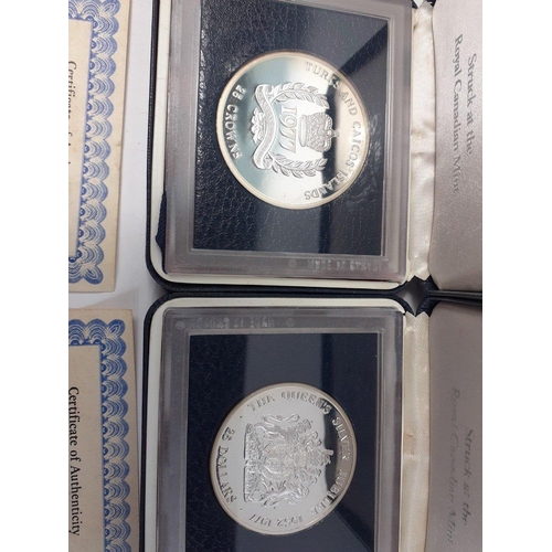 324 - Two proof slabbed and cased 1977 QUEENS SILVER JUBILEE coins to include Cayman Islands $25 and Turks... 