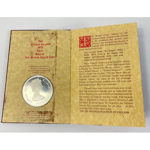 327 - CAYMEN ISLANDS 1975 Fifty Dollar Six Queen Silver Coin in folder.  The Proof coin is in super encaps... 