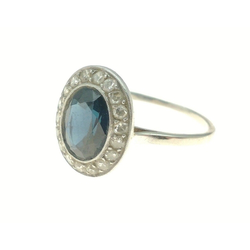 374 - A white metal oval shaped blue stone and diamond ring size M, gross weight 2.60g#8