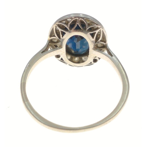 374 - A white metal oval shaped blue stone and diamond ring size M, gross weight 2.60g#8