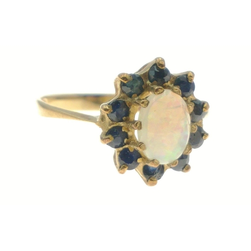 375 - OPPULENT OPAL! A 375 hallmarked yellow gold opal and blue stone ring, size M, gross weight 1.75g#9... 