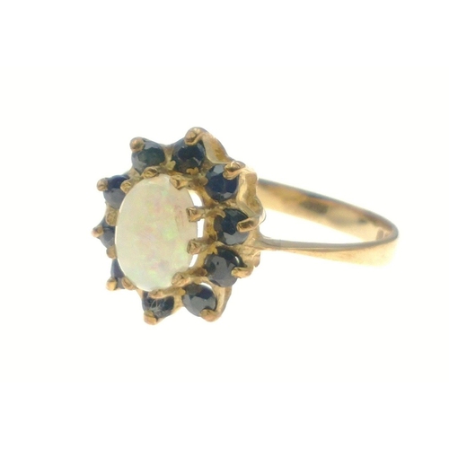 375 - OPPULENT OPAL! A 375 hallmarked yellow gold opal and blue stone ring, size M, gross weight 1.75g#9... 