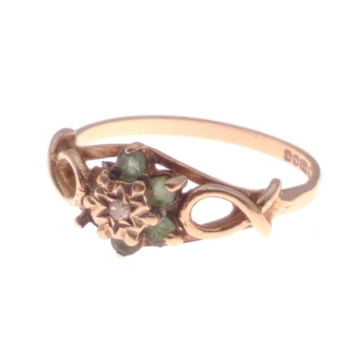 376 - A 375 hallmarked floral set yellow gold ring with green stones (2 missing), size N, gross weight 1.7... 