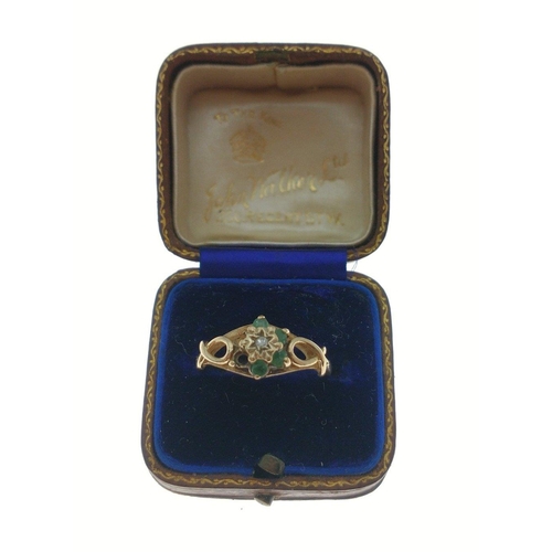 376 - A 375 hallmarked floral set yellow gold ring with green stones (2 missing), size N, gross weight 1.7... 