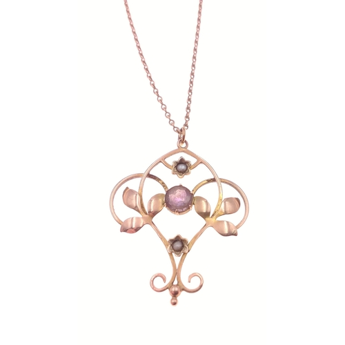 384 - A 9ct stamped floral openwork amethyst and pearl pendant with chain. The pendant is 3cm x 2.75cm, th... 