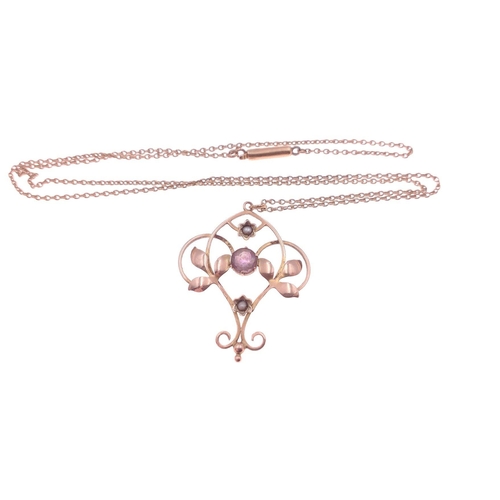 384 - A 9ct stamped floral openwork amethyst and pearl pendant with chain. The pendant is 3cm x 2.75cm, th... 