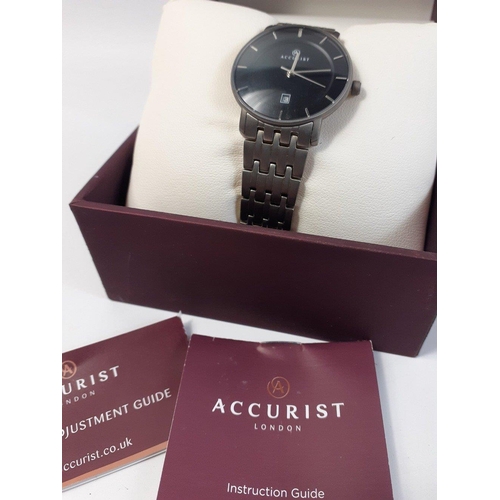 408 - A boxed gent's titanium ACCURIST watch with black face and silver numerals, (Japan MVT GL10) model 8... 