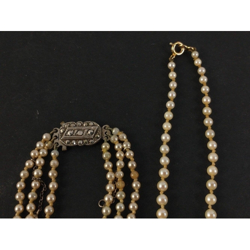 446 - A boxed 52cm string of graduated pearls with yellow metal clasp and a boxed 3 string set of LOTUS si... 