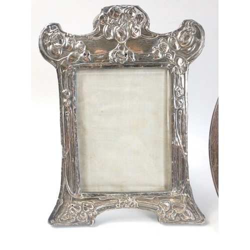 474 - Two silver hallmarked photo frames the first Birmingham 1903 is an ornate frame with some age approp... 