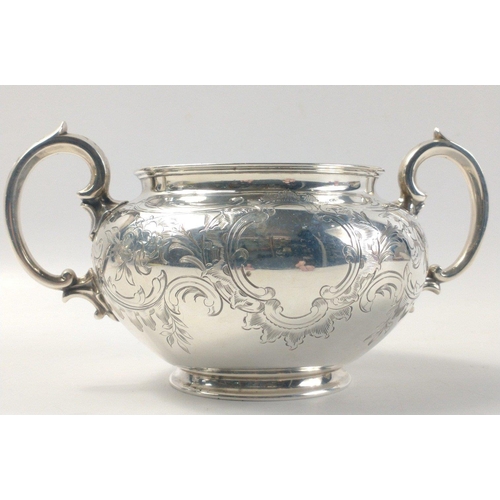 476 - A stunning Victorian solid silver teapot, cream jug and sugar bowl.  Superb bright cut design and al... 