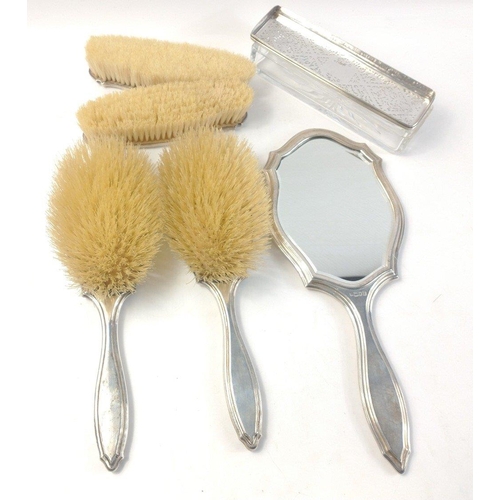 480 - A silver monogrammed dressing table set comprising a hand mirror, 2 hair brushes and 2 clothes brush... 