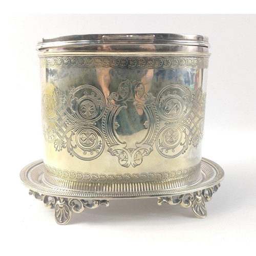 491 - A versatile oval white metal lidded box -  tea caddy, tobacco jar or biscuit barrel, on its own base... 