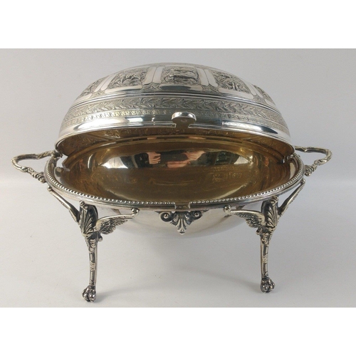 492 - An oval white metal chafing dish with lid decorated with repoussé zodiac symbols standing on 4 legs,... 