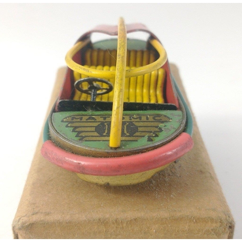 537 - Unusual MATOMIC 1950s push along small tin plate model of a futuristic car.  Approx 8cm long and ver... 