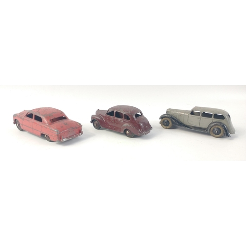 554 - Small collection of three DINKY diecast early models to include Ford Sedan, Austin Devon with maroon... 