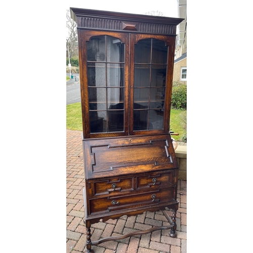 815 - A rather impressive two door glazed BOOKCASE/BUREAU with stretchered base on candy-twist leg support... 