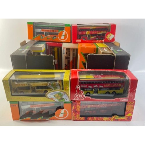 115 - A small collection of diecast bus models with an oriental theme.  Fifteen in total by Corgi, Creativ... 