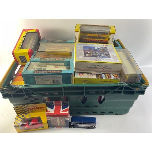 123 - A substantial collection of diecast bus models with an oriental theme.  Over thirty pieces however m... 