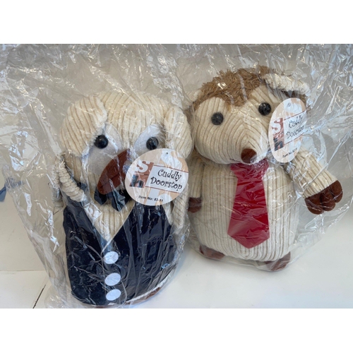 139 - Two CUDDLY DOORSTOP branded doorstops - brand new and still in their original packaging! - both stan... 