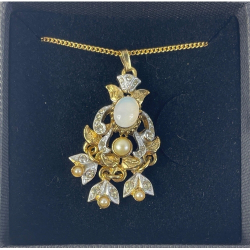 14 - A Victorian inspired yellow metal necklace with an unusual moonstone and pearl drop pendant approx 4... 