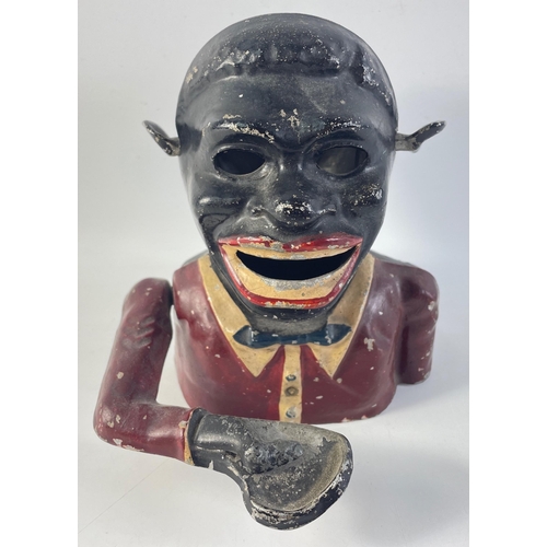 142 - A vintage cast iron money box (missing eyes)#145