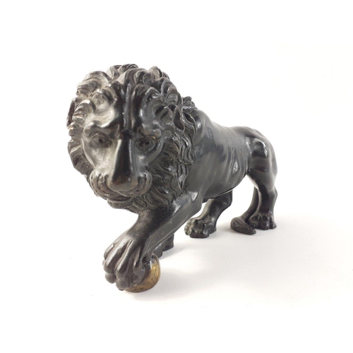 144 - A beautiful and substantial bronze Lion.  Superbly well-sculpted Lion clutching a ball, measures app... 