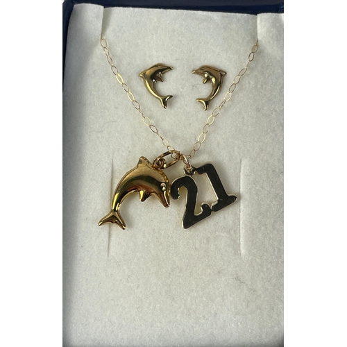 15 - A yellow metal chain with a 21 and a dolphin pendant plus a pair of dolphin earrings#15