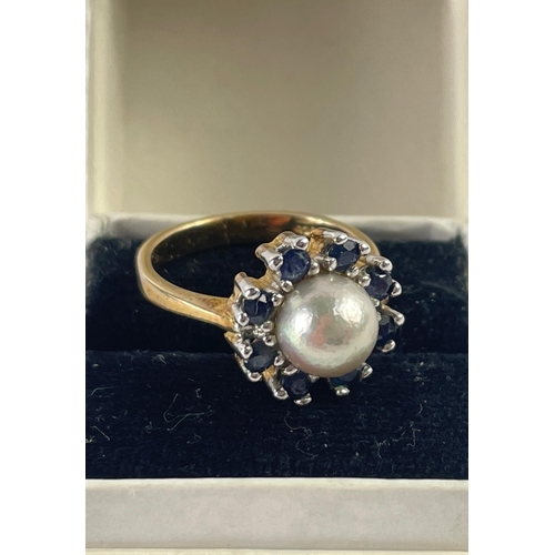 19 - A ring stamped 925 with blue stones surrounding a pearl, size L, gross weight 3.85g#19