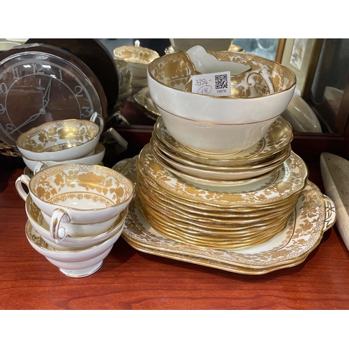 205 - A HAMMERSLEY tea service in white with gilt design (pattern no 14433) to include 6 cups (1 with chip... 