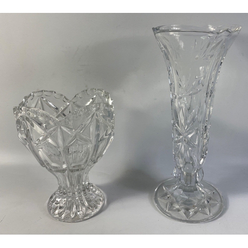 228 - A crystal flower vase with nice etched petal design standing 25cm tall and a smaller pretty vase.  B... 