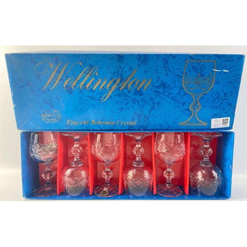 229 - A boxed set of six rather nice Bohemian cut glass crystal wine glasses, all in good useable conditio... 