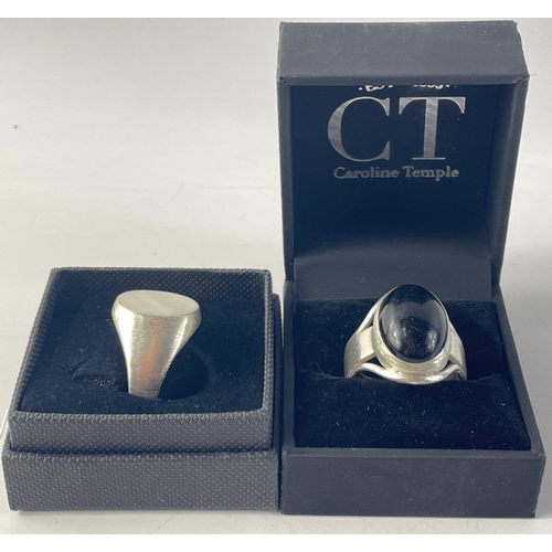 25 - A gent's silver ring with black stone hallmarked London 1975, size U/V, and a gent's silver signet r... 