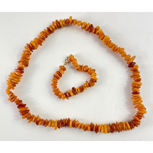 32 - A string of amber beads, approx 56cm long with matching bracelet 20cm long, gross weight 63.7g appro... 