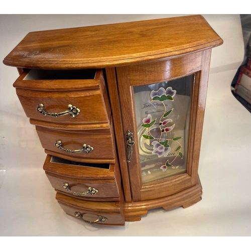 43 - A wooden bijouterie dressing table-top cabinet with four drawers and a glazed door - dimensions 28cm... 