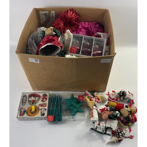 502 - A box of Christmas decorations including tinsel and Father Christmas figures#520