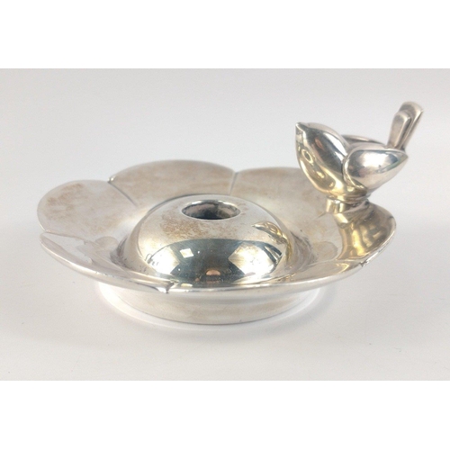 84 - A pair of CHRISTOFLE stamped silver plate candle holders in floral form with feature small bird hand... 