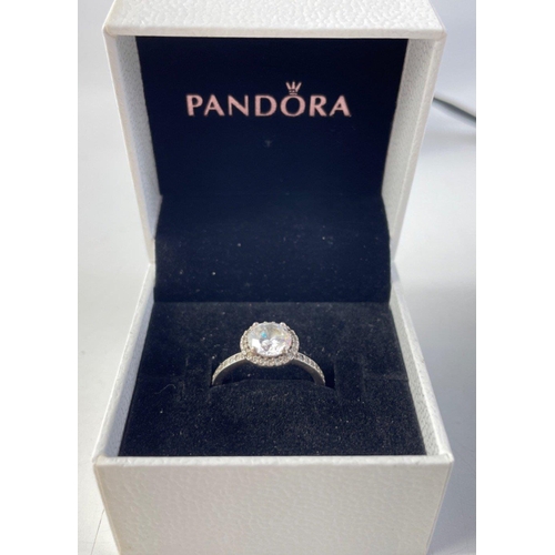 101 - A pair of lovely PANDORA Silver 925 stamped rings in original boxes. Love heart band and a pretty gl... 