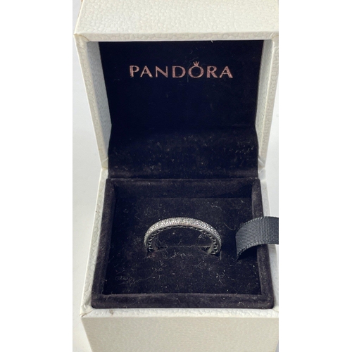 101 - A pair of lovely PANDORA Silver 925 stamped rings in original boxes. Love heart band and a pretty gl... 