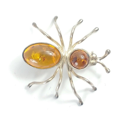 122 - An AMBER and unmarked CONTINENTAL SILVER brooch gross weight 5.93g approx length 3.5cm approx#121... 