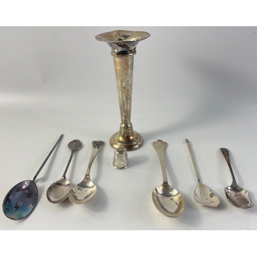 197 - A collection of various silver hallmarked spoons, weight 103g, a silver thimble with a cat design an... 